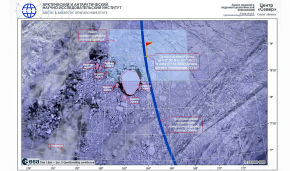 Crew of North Pole ice-resistant platform in search of ice floe for research work