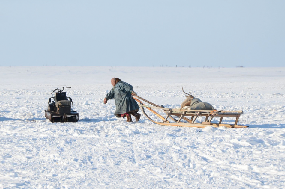 Photograph: Bringing a gift to the village Photograph: Bringing a gift to the village