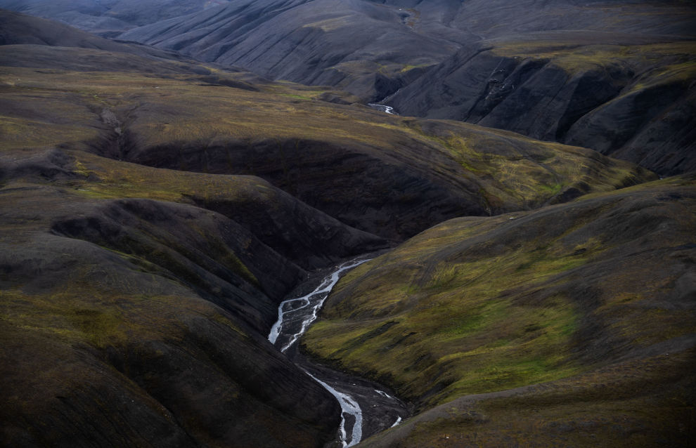 A picture shows a view of an island from a helicopter near the Svalbard archipelago, Norway