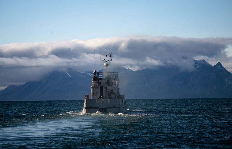 A view shows a ship near an island of the Svalbard archipelago, Norway