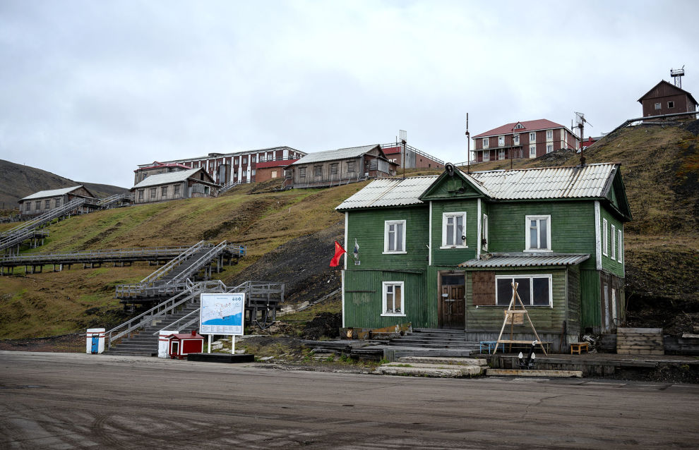 A view shows a wooden building at the port in the settlement of Barentsburg on the Svalbard archipelago
