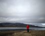 A man is seen on an island near the Barentsburg settlement on the Svalbard archipelago, Norway