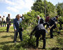 Honorary guests plant lilac bushes