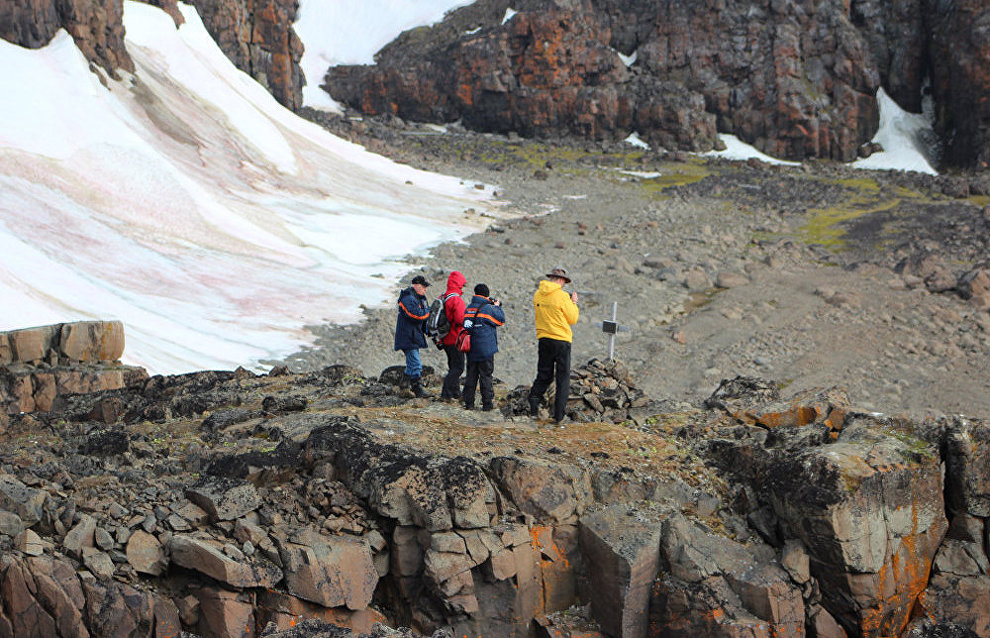 Tourists near the grave of Otto Krisch on Wilczek Island, Franz Josef Land