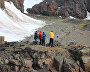 Tourists near the grave of Otto Krisch on Wilczek Island, Franz Josef Land
