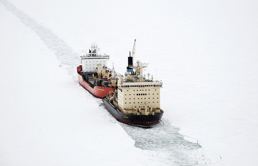 The Taimyr icebreaker leads the Yury Arshenevsky lighter carrier ship along the Yenisei