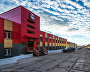 Barentsburg’s central and only street. The Barentsburg Mining Plant Directorate is seen on the left. Photo by Sergei Dolya