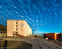 Barentsburg Hotel is seen on the left, and a hospital and an outpatient clinic are on the right. Both buildings were given a major overhaul in 2013. Photo by Sergei Dolya