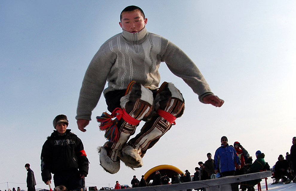 Jumping over dog sleds