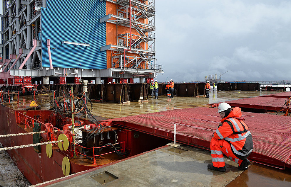 Workers at the construction site of the Yamal LNG plant and the Sabetta sea port