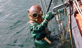 Northern Fleet divers raise an Airacobra fighter plane from a lake on the Kola Peninsula