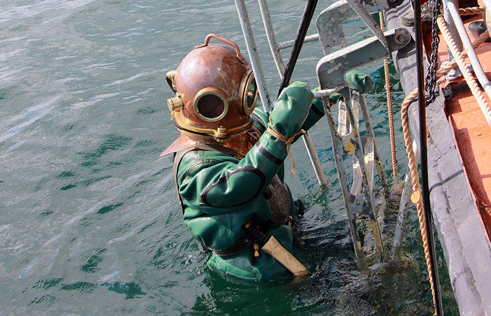 Northern Fleet divers raise an Airacobra fighter plane from a lake on the Kola Peninsula