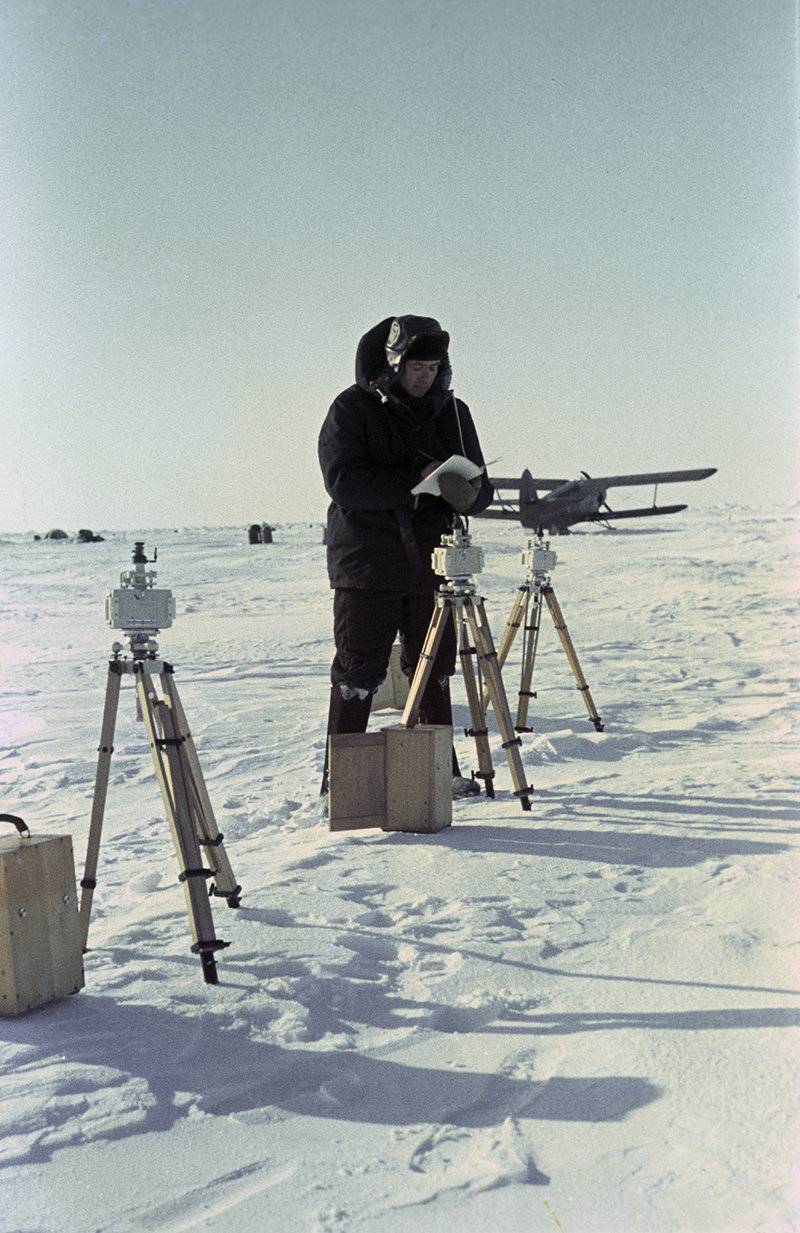 The Soviet North Pole 8 drifting research station. A researcher is taking readings