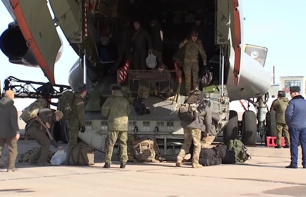 Russian paratroopers go aboard an Ilyushin Il-76 aircraft to perform a group jump from 10,000 m of altitude, using new parachute systems in extreme Arctic conditions near the Franz Josef Land Archipelago