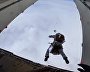 Russian paratroopers perform a group jump from an Ilyushin Il-76 aircraft from 10,000 m of altitude, using parachute systems in the extreme Arctic conditions near the Franz Josef Land Archipelago