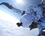 Russian paratroopers perform a group jump from an Ilyushin Il-76 aircraft from 10,000 m of altitude, using parachute systems in the extreme Arctic conditions near the Franz Josef Land Archipelago