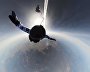 Russian paratroopers perform a group jump from an Ilyushin Il-76 aircraft from 10,000 m of altitude, using parachute systems in the extreme Arctic conditions near the Franz Josef Land Archipelago