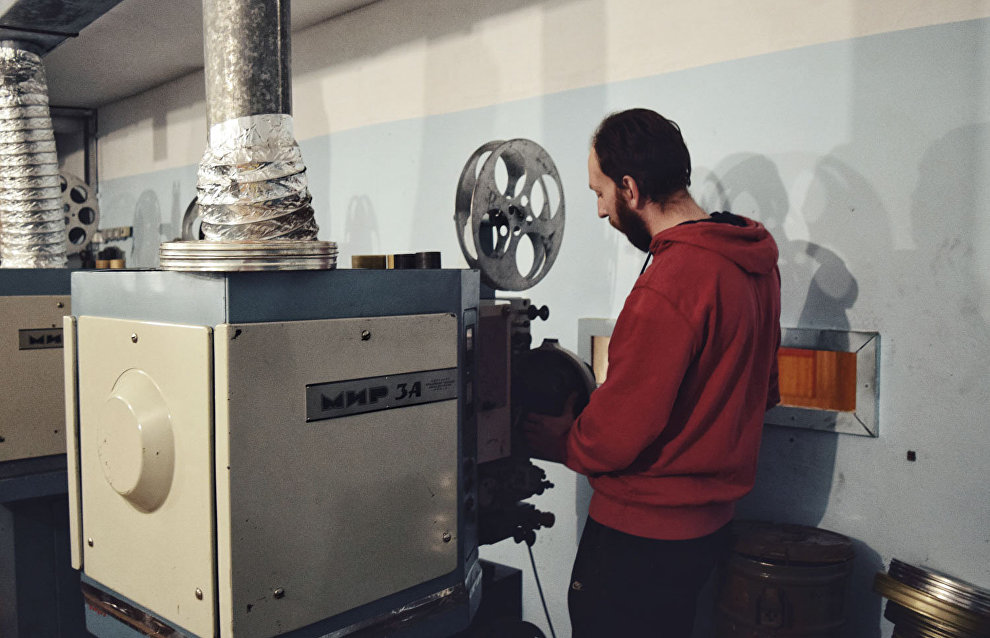 Stanislav Schubert works with Mir movie projectors