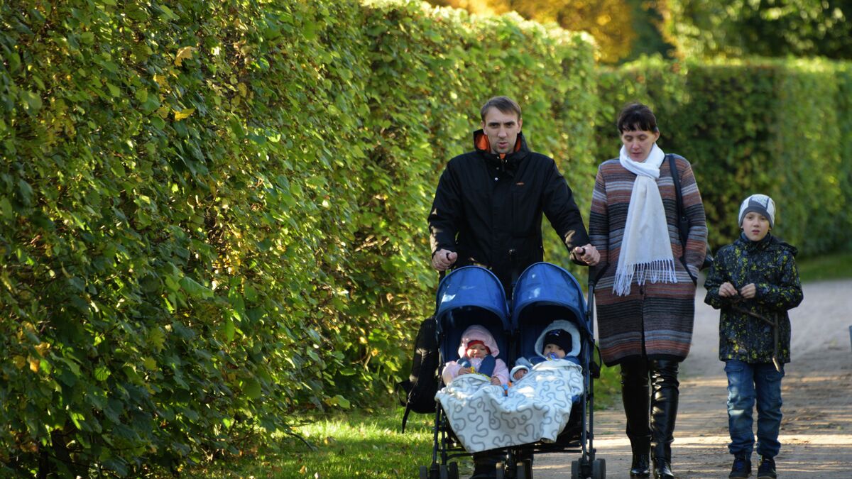 A family with children strolling in the park