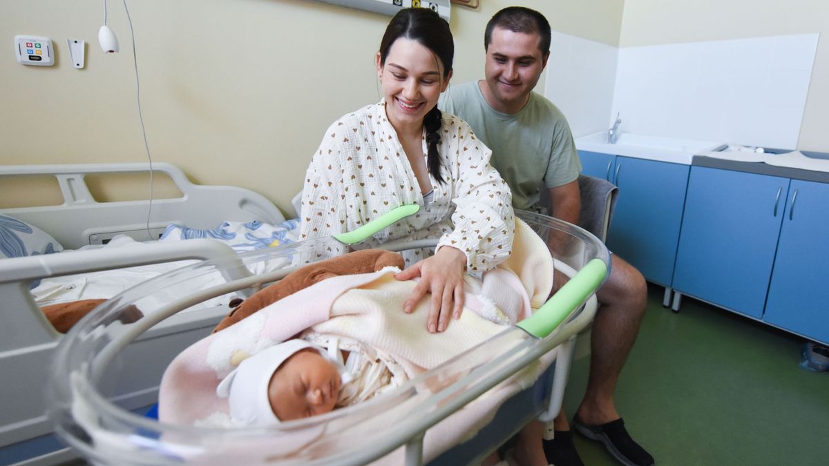 Young parents with their newborn baby