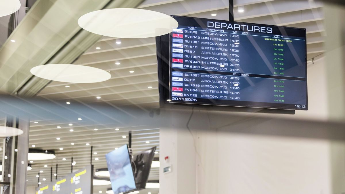 An electronic screen showing departures at a new terminal of Murmansk airport