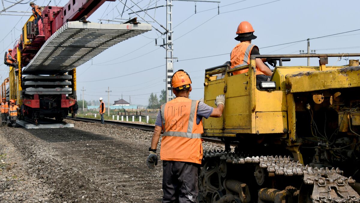 Workers engaged in track-laying operations 