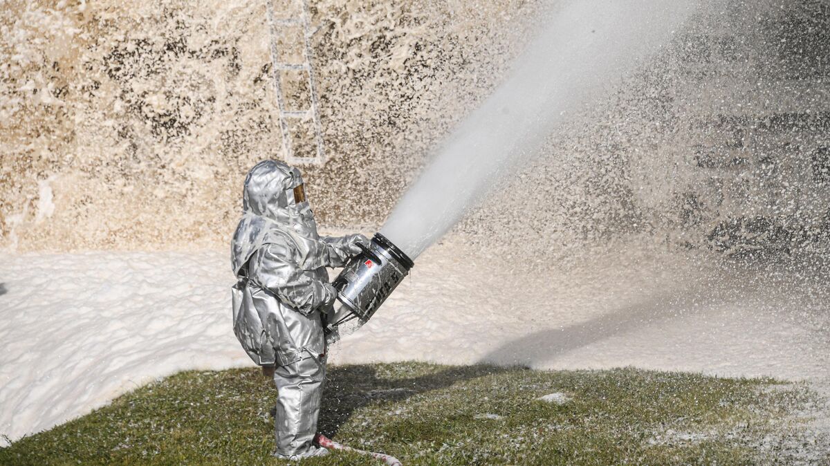 A rescue worker drilling oil spill removal 