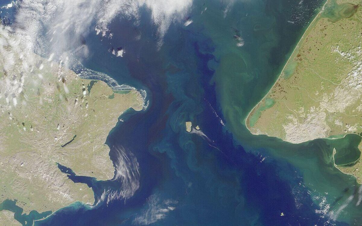 View from outer space. Eurasia on the left, America on the right. Between them are the Diomede Islands (Gvozdev Islands).  Big Diomede Island (Ratmanov Island, Russia) and Little Diomede Island (Krusenstern Island, United States). These may become key stations for a future tunnel under the Bering Strait