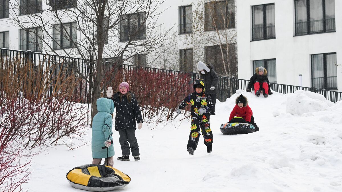 A woman and her children take a walk