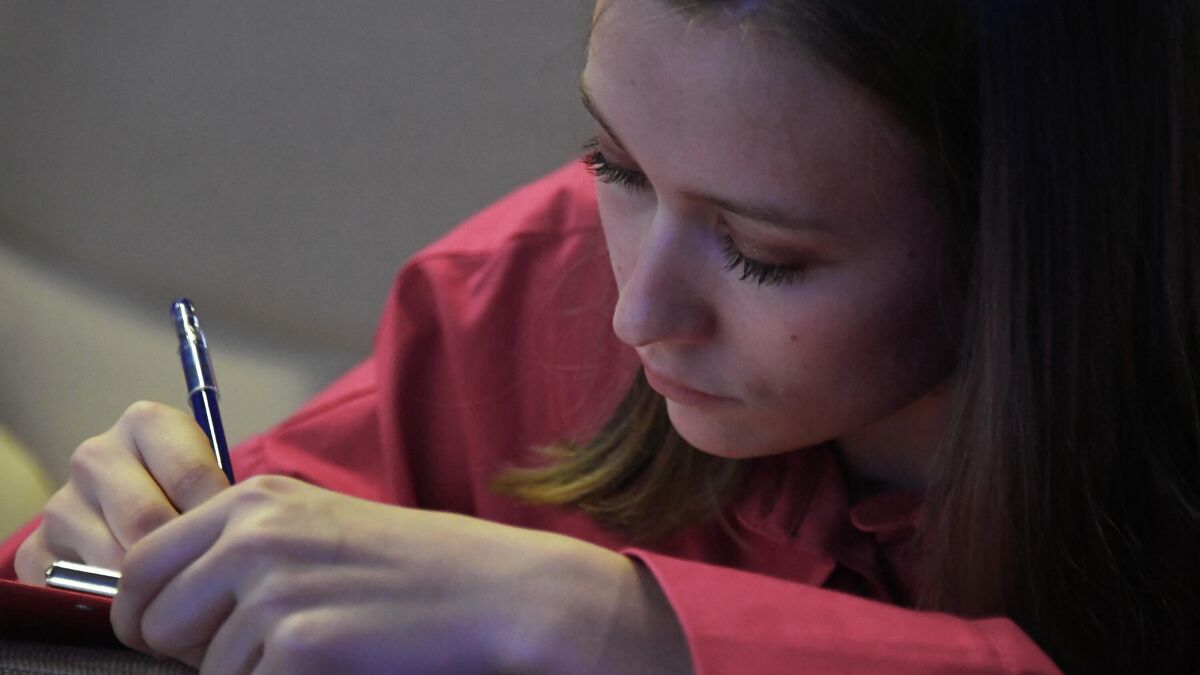 A woman takes part in a dictation