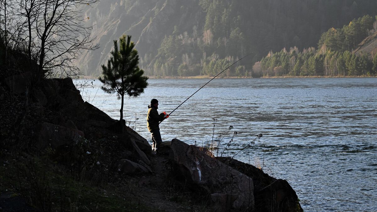 A man fishing on the banks of the Yenisei
