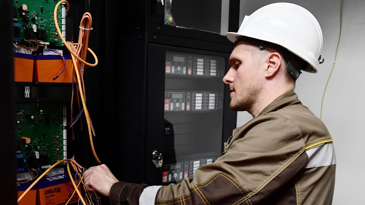 A worker installing network equipment