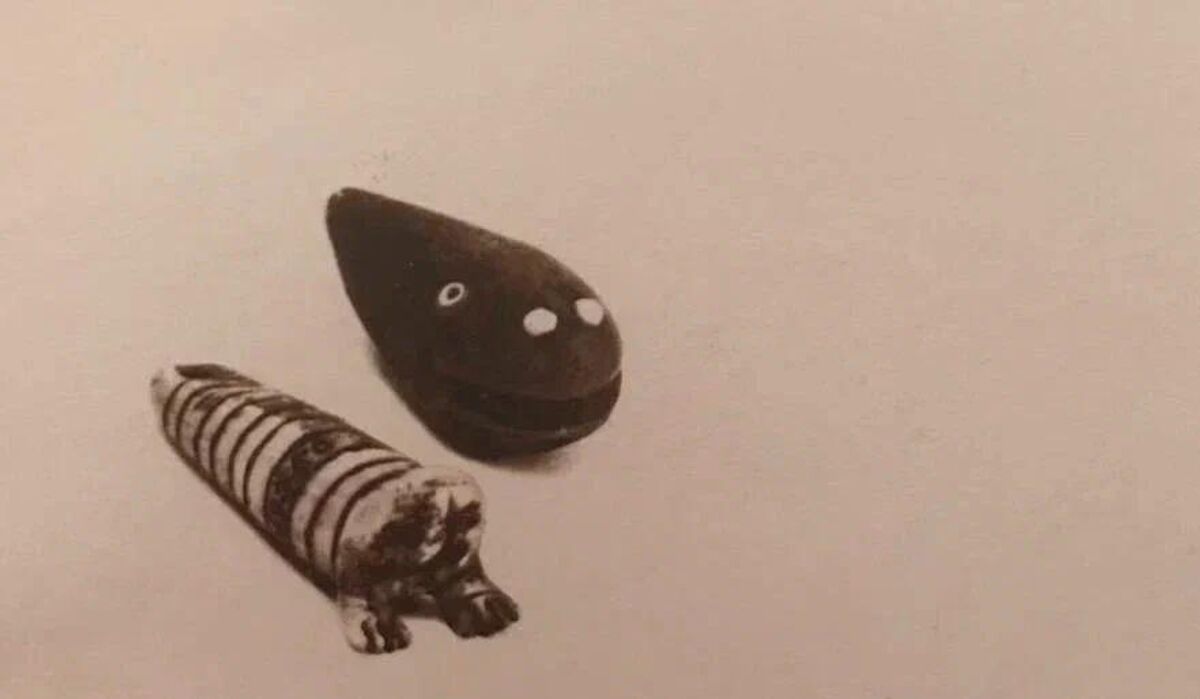 An archive image of a wood-carved baby whale 