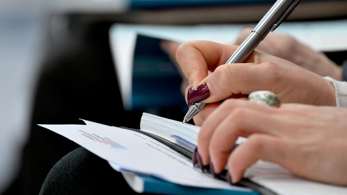 Woman writing in a notebook