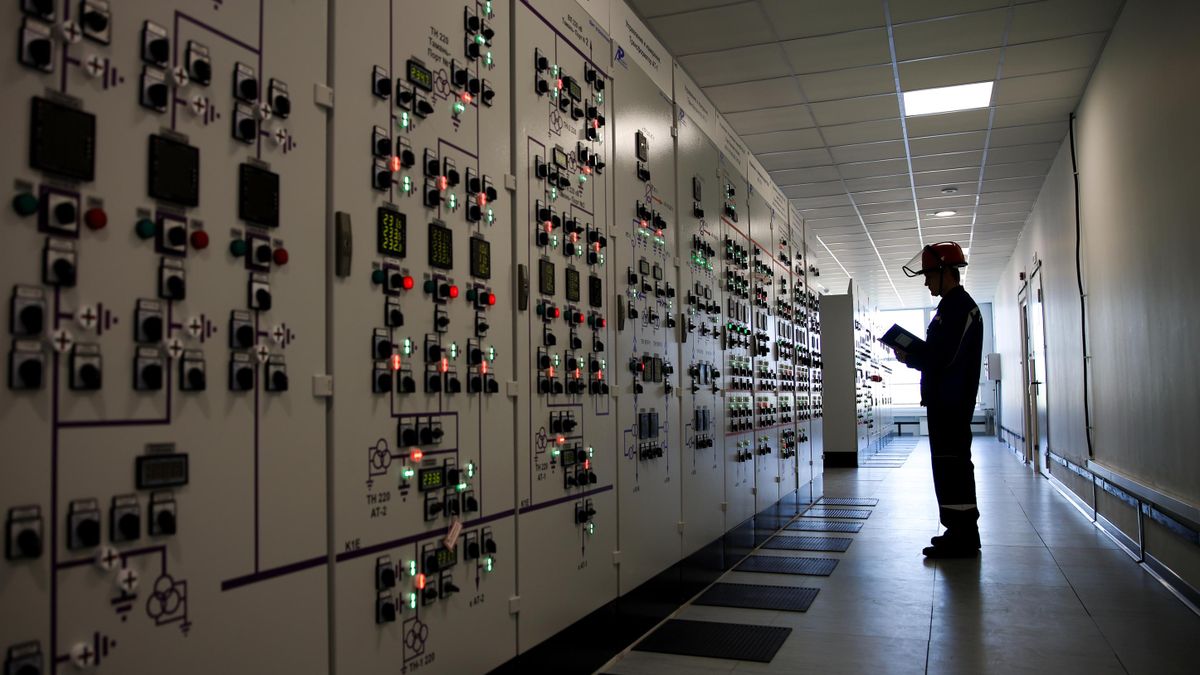 An employee at an electric substation