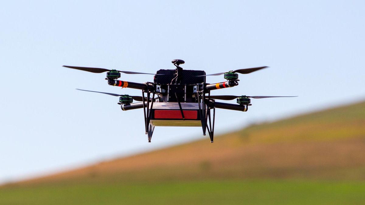 An aerial drone carries mail