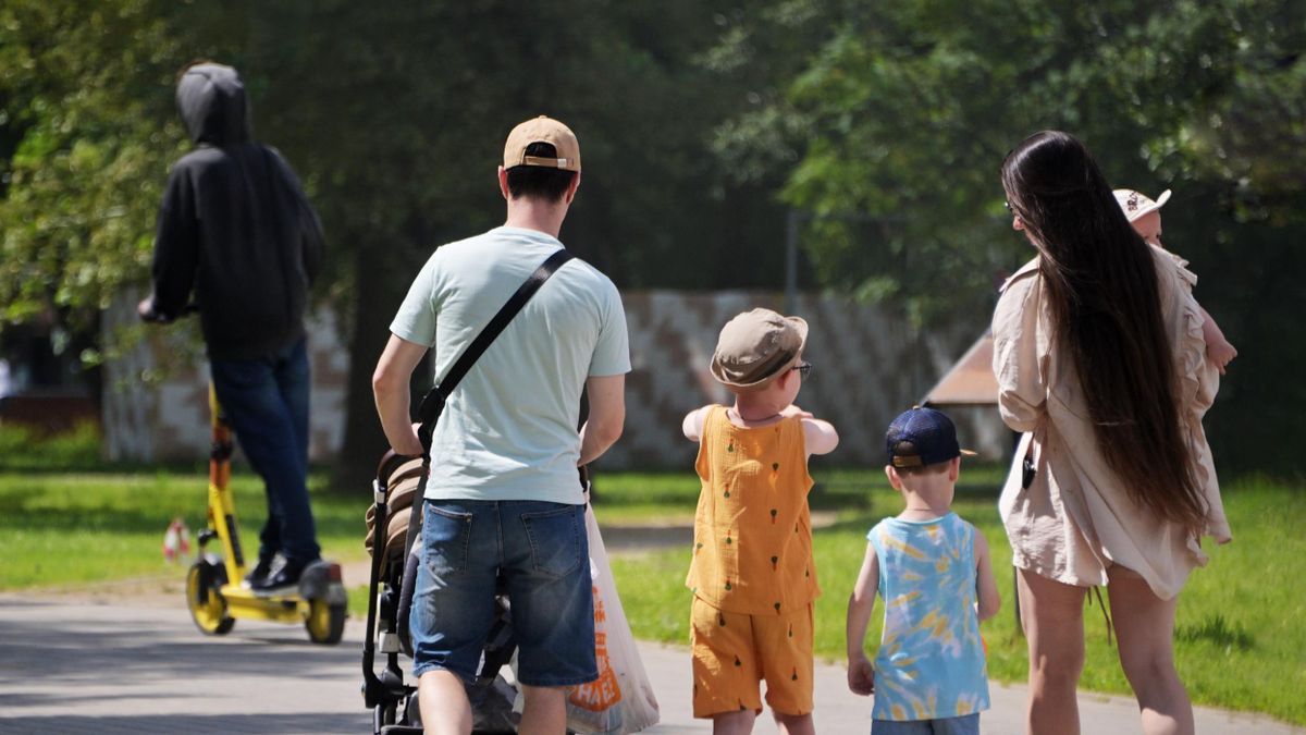 A family with many children takes a walk