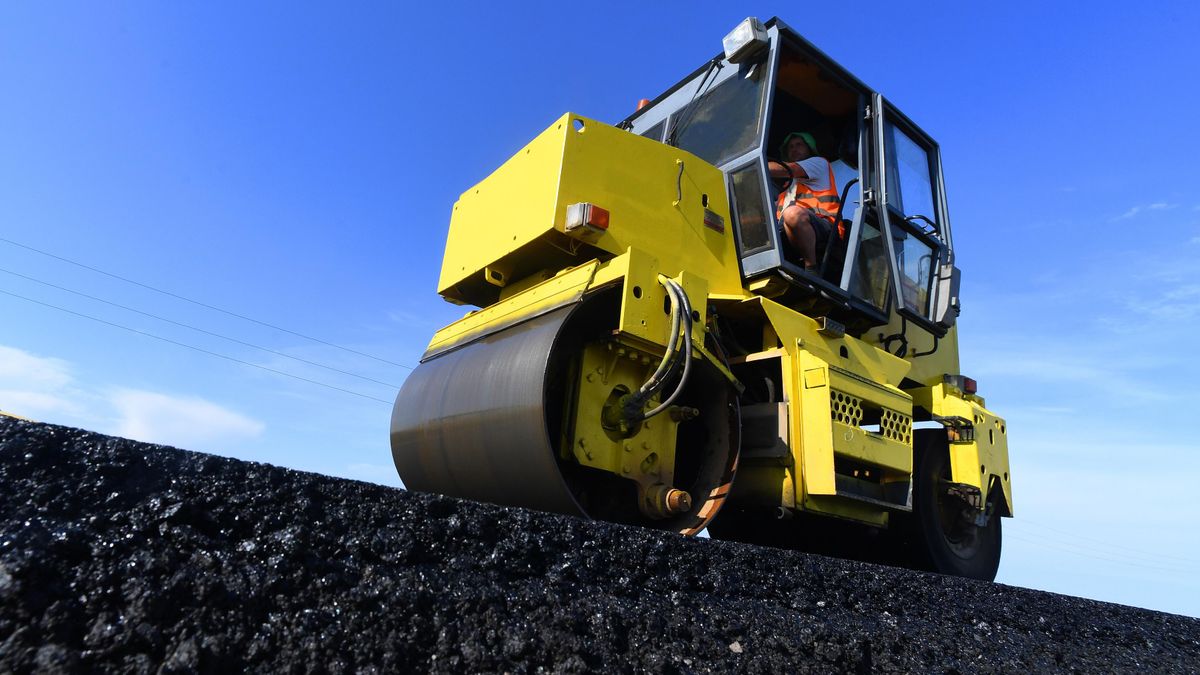 Road construction equipment during asphalt-laying operations