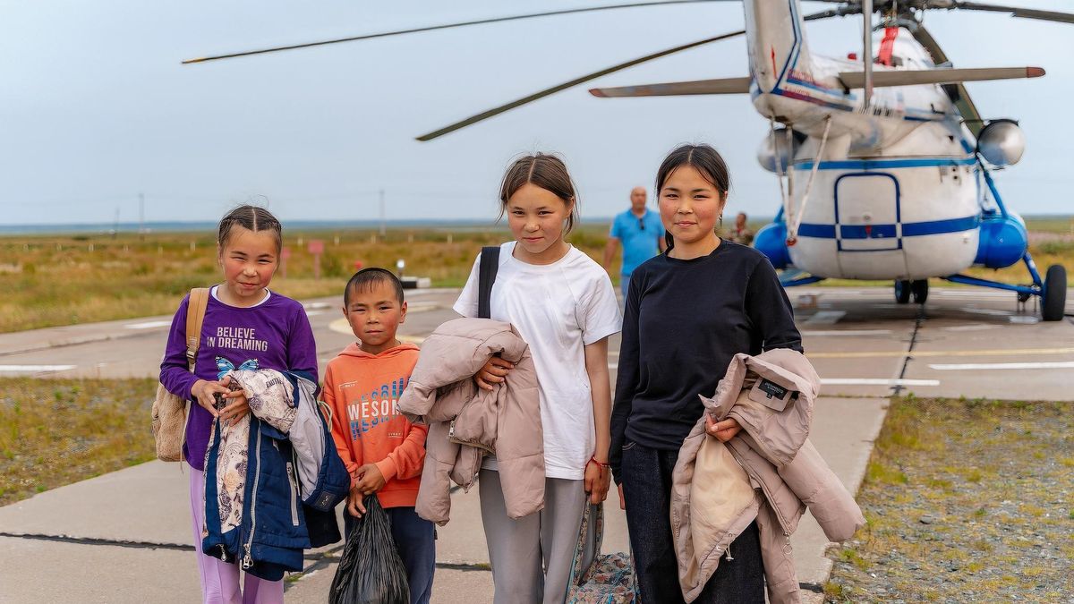 Children from Indigenous Small-Numbered Peoples of the North communities get ready to travel to school