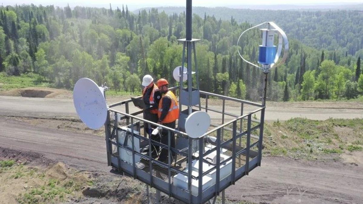 Workers install an autonomous communication system