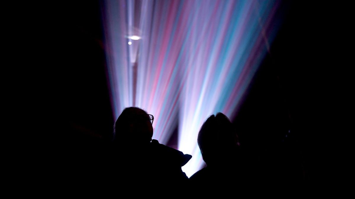 Audience silhouettes in the stage lights 